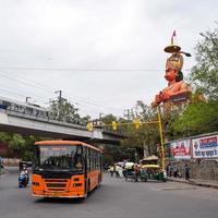 New Delhi, India - June 21, 2022 - Big statue of Lord Hanuman near the delhi metro bridge situated near Karol Bagh, Delhi, India, Lord Hanuman big statue touching sky photo