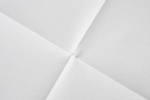 White folded and wrinkled paper texture background photo