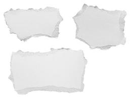 White ripped paper torn edges strips isolated on white background photo