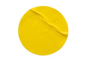 Yellow round paper sticker label isolated on white background photo