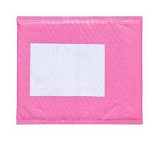 Pink plastic wrap air bubble packaging envelope with blank label sticker isolated on white background photo