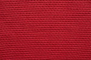 Red knitted cloth wool texture surface background photo