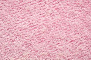 Pink fluffy towel fabric soft texture background photo