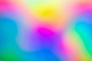 Abstract blur holographic rainbow foil iridescent background photo