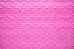 Pink plastic wrap air bubble texture background packaging material photo