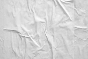 white crumpled and creased paper poster texture background photo