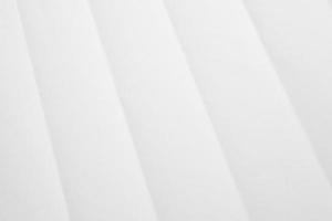 White folded and wrinkled paper texture background photo