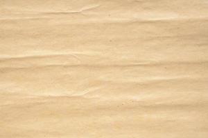 Old crumpled brown vintage paper texture background photo