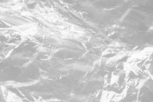 transparent plastic bag texture on white background photo