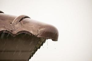 rain falling down from the house roof photo