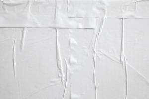 white crumpled and creased paper poster texture background photo