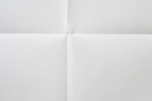 White folded and wrinkled paper texture background photo