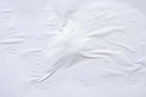 white crumpled and creased paper poster texture background photo