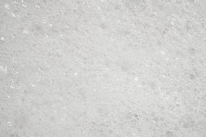 Abstract white soap foam texture background close up photo