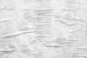 white crumpled and creased paper poster texture background photo