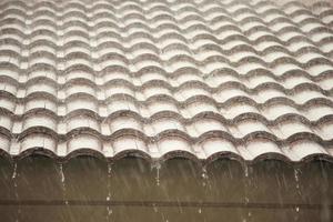 rain falling down from the house roof photo