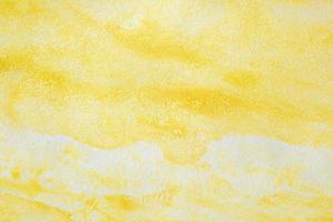 Abstract yellow watercolor paint paper background texture photo
