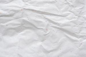 white crumpled and creased recycle paper texture background photo