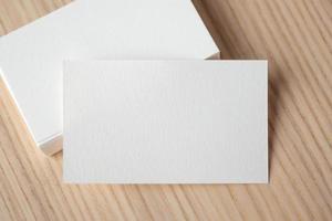 White business card on wood table background photo