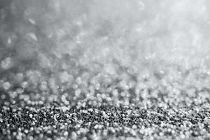 Abstract silver glitter sparkle texture with bokeh background photo