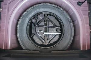 spare tire in the modern compact car photo