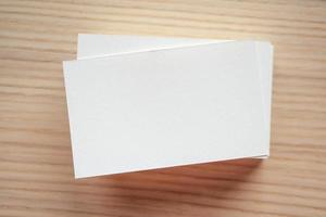 White business card on wood table background photo