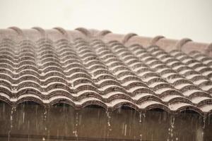 rain falling down from the house roof photo