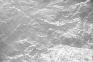 transparent plastic bag texture on white background photo