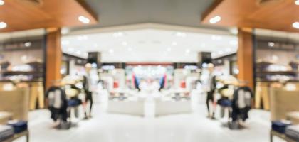 Abstract blur clothing boutique display interior of shopping mall background photo