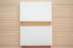 White business card on wood table background photo