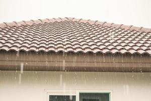 rain falling down from the house roof photo