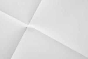 White folded and wrinkled paper texture background photo