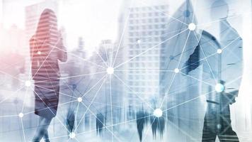 Blockchain network on blurred skyscrapers background. Financial technology and communication concept. photo