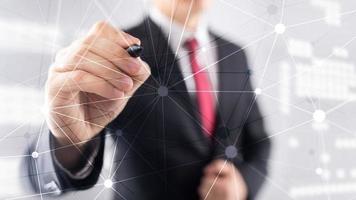 Blockchain network on blurred skyscrapers background. Financial technology and communication concept photo