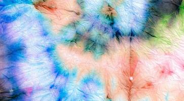 Red Spiral Tie Dye. Tye Style Background. Textile photo