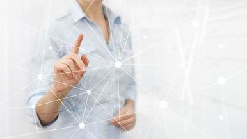 Blockchain network on blurred skyscrapers background. Financial technology and communication concept. photo