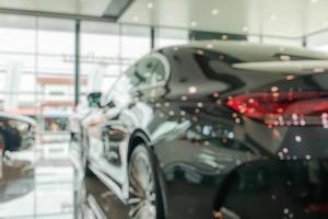 new cars in showroom interior blurred abstract background photo