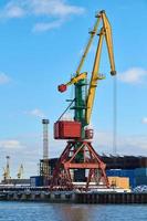 Harbor cranes, container ship terminal, cargo container yard photo