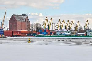 Harbor cranes, container ship terminal, cargo container yard photo