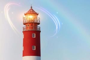 Lighthouse in Baltiysk port. Beautiful rainbow and beacon lights. Clean blue sky, copy space.