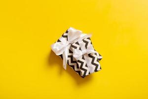 Flat lay composition with beautiful gift boxes with bow on color background photo