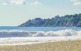 Extremely huge big surfer waves at beach Puerto Escondido Mexico. photo