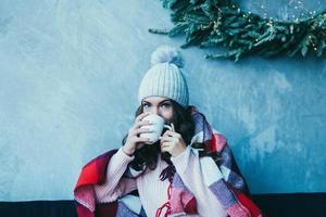 Woman hands hold a hot mug of coffee photo