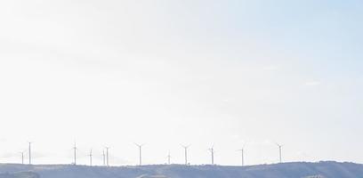 Wind turbine generate electricity with blue sky at Khao Kho Thailand. photo