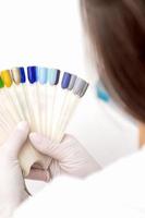 Manicurist holding nail color samples. photo