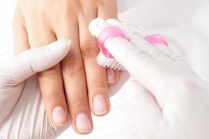 Manicure master removes dust. photo