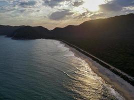 Rio de Janeiro, RJ, Brazil, 2022 - Aerial view of Grumari Beach, one of the wildest beaches in Rio de Janeiro photo