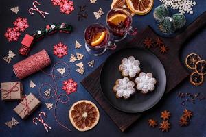 Hot mulled wine with a slice of orange, with cinnamon, cloves and other spices photo