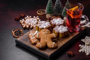 Hot mulled wine with a slice of orange, with cinnamon, cloves and other spices photo