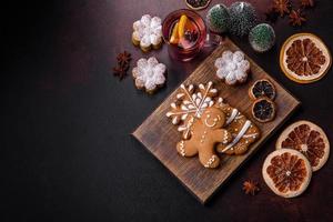 Hot mulled wine with a slice of orange, with cinnamon, cloves and other spices photo